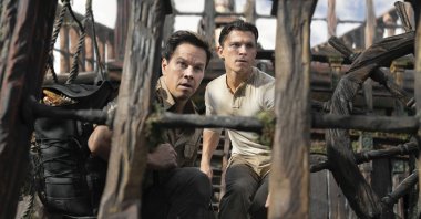 Mark Wahlberg (L) and Tom Holland, in a scene from the film "Uncharted." (AP Photo)