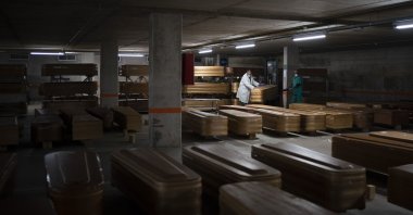 Coffins carrying the bodies of people who died of coronavirus and are waiting to be buried or incinerated in an underground parking lot at the Collserola funeral home in Barcelona, Spain, April 2, 2020. (AP Photo)