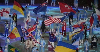Flag bearers take part in the closing ceremony at the 2022 Winter Paralympics, Beijing, China, March 13, 2022. (AP Photo)