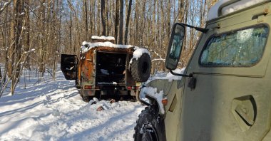A body of a Russian soldier is seen close to a destroyed Russian infantry GAZ Tigr mobility vehicle in a forest not far from Kharkiv, eastern Ukraine, March 6, 2022. (AFP File Photo)
