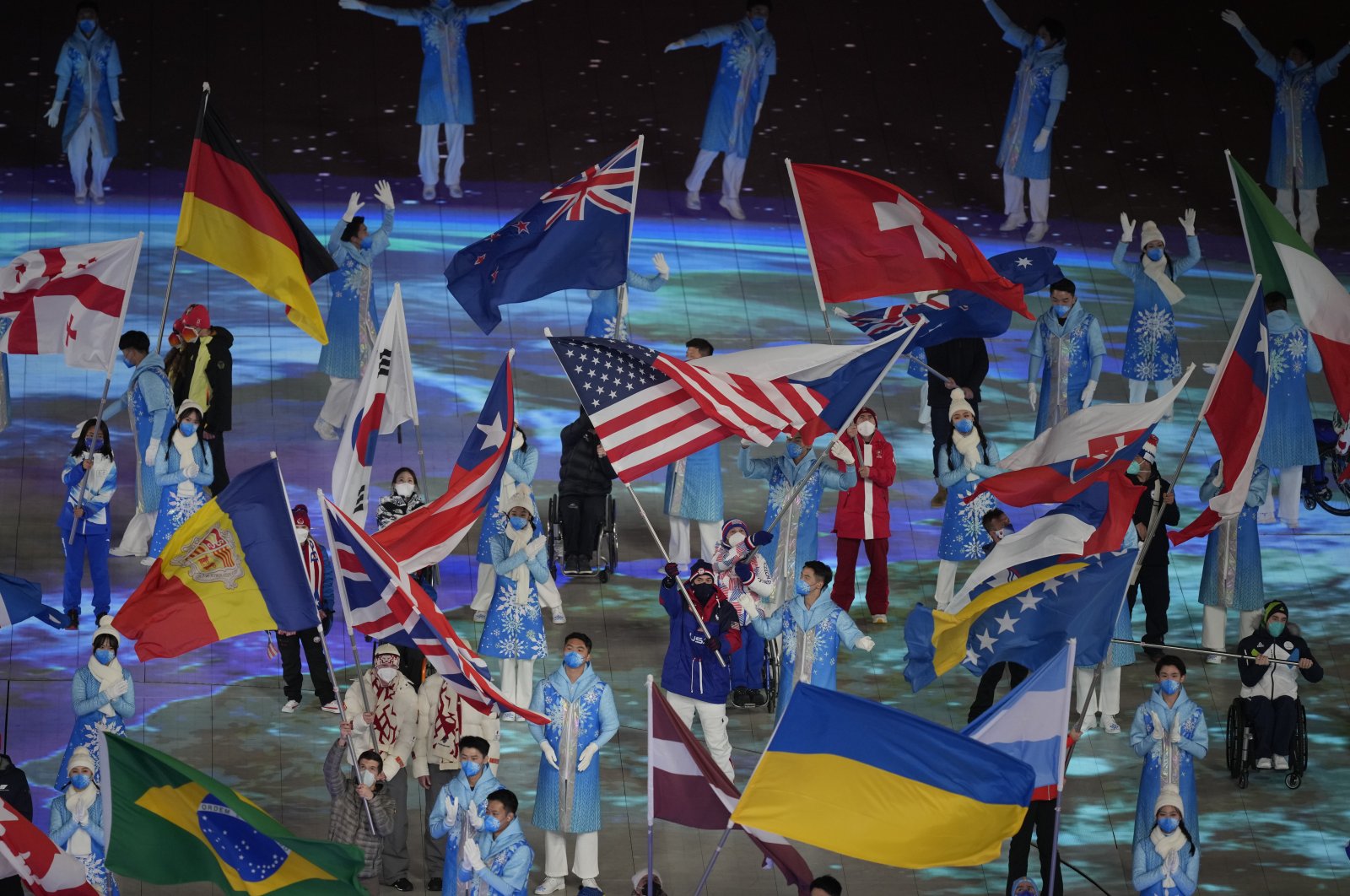 Flag bearers take part in the closing ceremony at the 2022 Winter Paralympics, Beijing, China, March 13, 2022. (AP Photo)