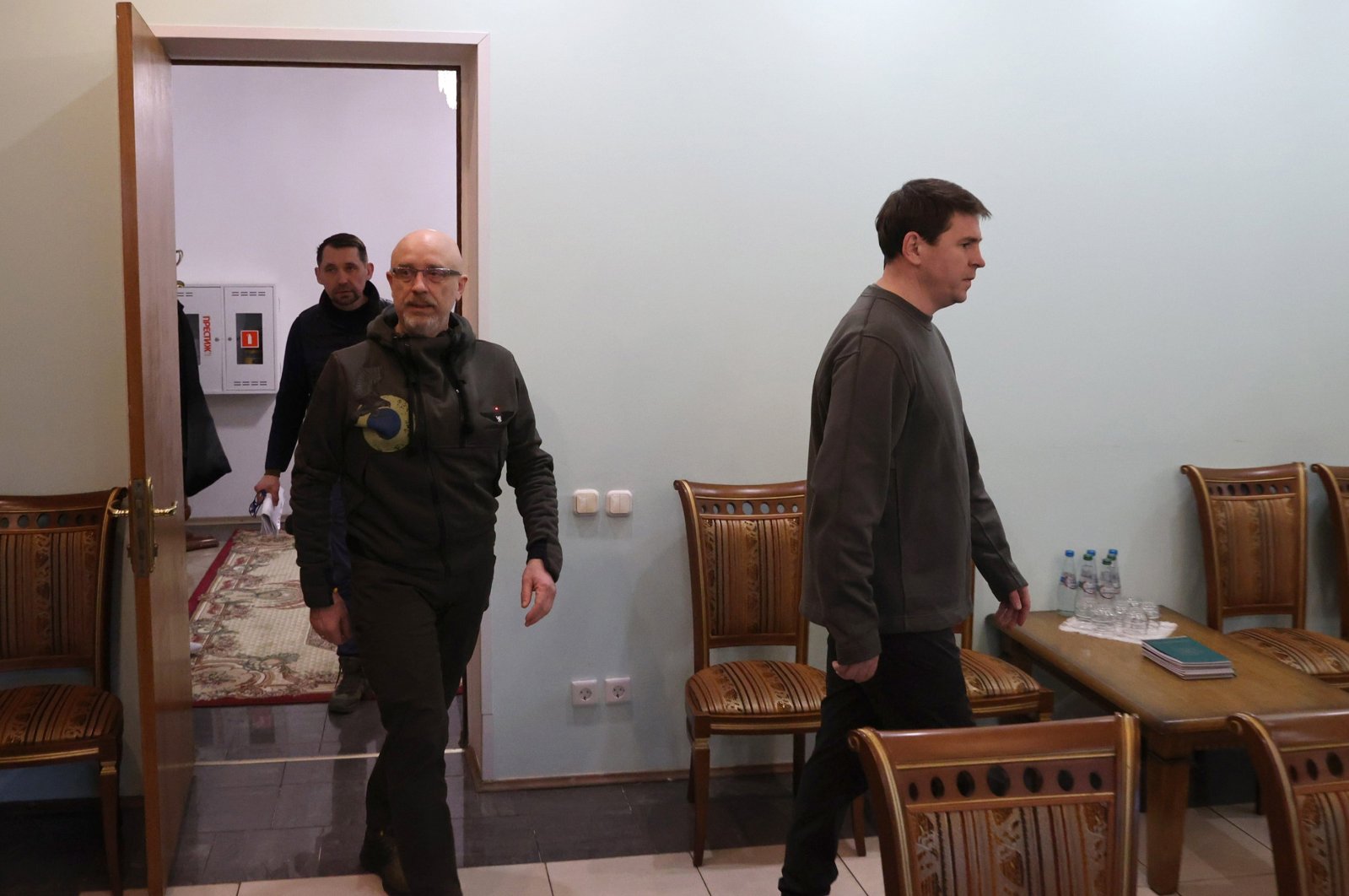 A handout photo made available by BelTA news agency shows Ukraine&#039;s presidential advisor Mykhailo Podolyak (R) and Ukrainian Defense Minister Oleksii Reznikov (2nd R) arriving to attend Russia-Ukraine cease-fire negotiations, at an undisclosed location in the Brest region, Belarus, March 3, 2022. (EPA Photo)