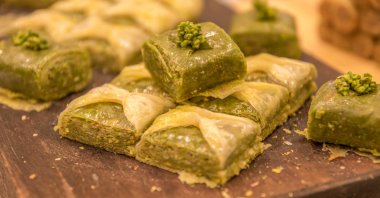 A close-up of pistachio baklava on a cutting board. (Getty Images)