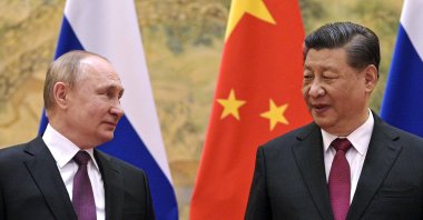 Chinese President Xi Jinping (R) and his Russian counterpart Vladimir Putin talk to each other during their meeting in Beijing, China, Feb. 4, 2022. (AP File Photo)