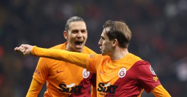Galatasaray star Kerem Aktürkoğlu makes his signature "Harry Potter" move after scoring a goal as his teammate Taylan Antalyalı joins the celebration during the Turkish Super Lig match against Beşiktaş at the Ali Sami Yen Sports Complex in Istanbul, Turkey, March 14, 2022 (AA Photo)