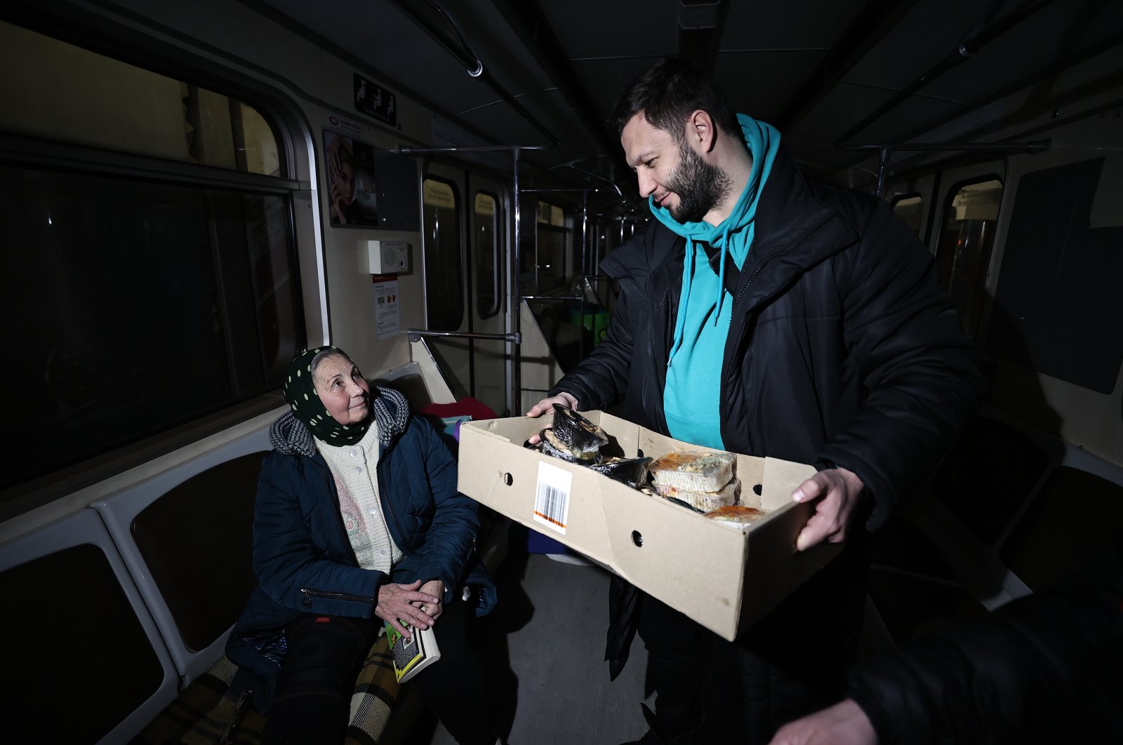 Onur Hekim delivers food to Ukrainians sheltering at a metro station, in Kyiv, Ukraine, March 14, 2022. (AA PHOTO)