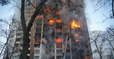 Rescuers work next to a residential building damaged by shelling, as Russia's attack on Ukraine continues, Kyiv, Ukraine, March 15, 2022. (Reuters Photo)