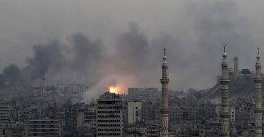 A ball of fire rises following a Syrian government airstrike that hit rebel positions in the eastern neighborhoods of Aleppo, Syria, Dec. 5, 2016. (AP Photo)