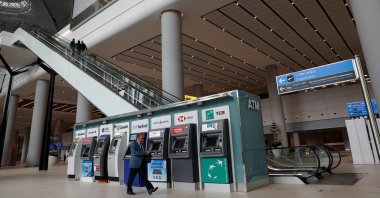 A man walks past ATM machines at the arrivals terminal of Istanbul International Airport, Istanbul, Turkey, April 3, 2019. (Reuters Photo)