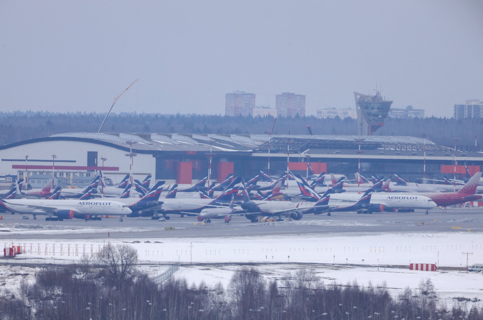 Passenger planes owned by Russia&#039;s airlines, including Aeroflot and Rossiya, are parked at Sheremetyevo International Airport in Moscow, Russia, March 12, 2022. (Reuters Photo)