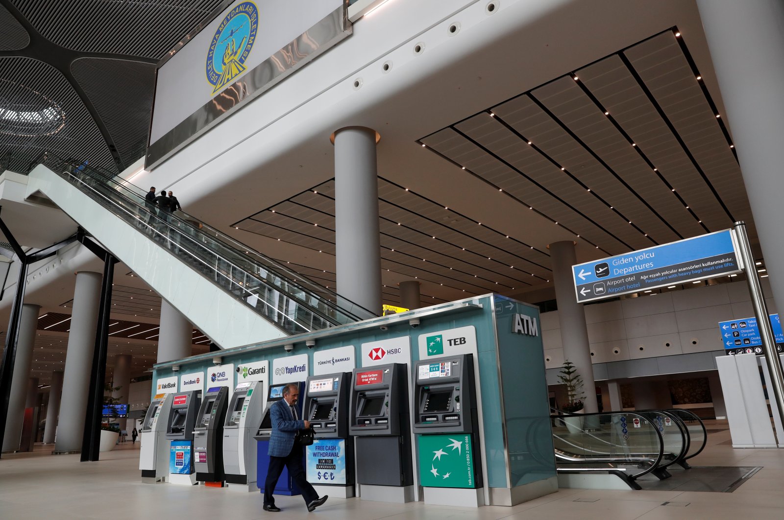 A man walks past ATM machines at the arrivals terminal of Istanbul International Airport, Istanbul, Turkey, April 3, 2019. (Reuters Photo)