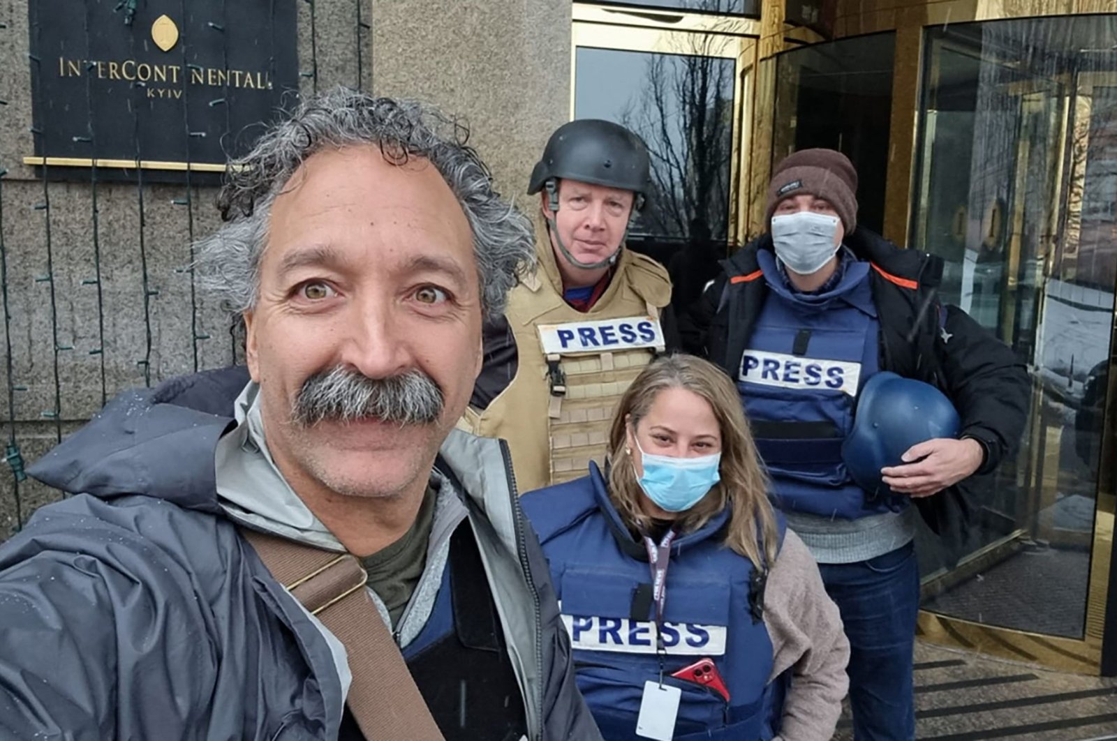 This undated image courtesy of Fox News shows cameraman Pierre Zakrzewski (L) posing with colleagues at the Kyiv Intercontinental Hotel. (AFP Photo)
