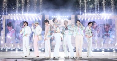 A handout photo made available by Big Hit Entertainment shows members of K-pop group BTS performing at a live in-person concert at Jamsil Olympic Park in southern Seoul, South Korea, March 10, 2022.  (EPA Photo)