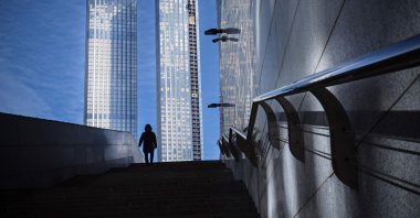 A man walks in front of Moscow's International Business Center (Moskva City) complex in Moscow, Russia, March 11, 2022. (AFP Photo)