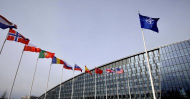 Flags of Alliance members flap in the wind outside NATO headquarters in Brussels, Friday, Feb. 28, 2020. (AP File Photo)