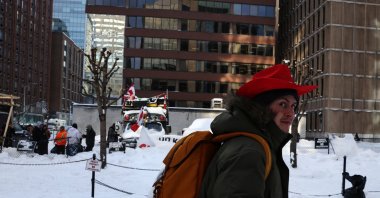 People walk on the snow-covered streets in Ottawa, Ontario, Canada, Feb. 19, 2022. (Reuters Photo)