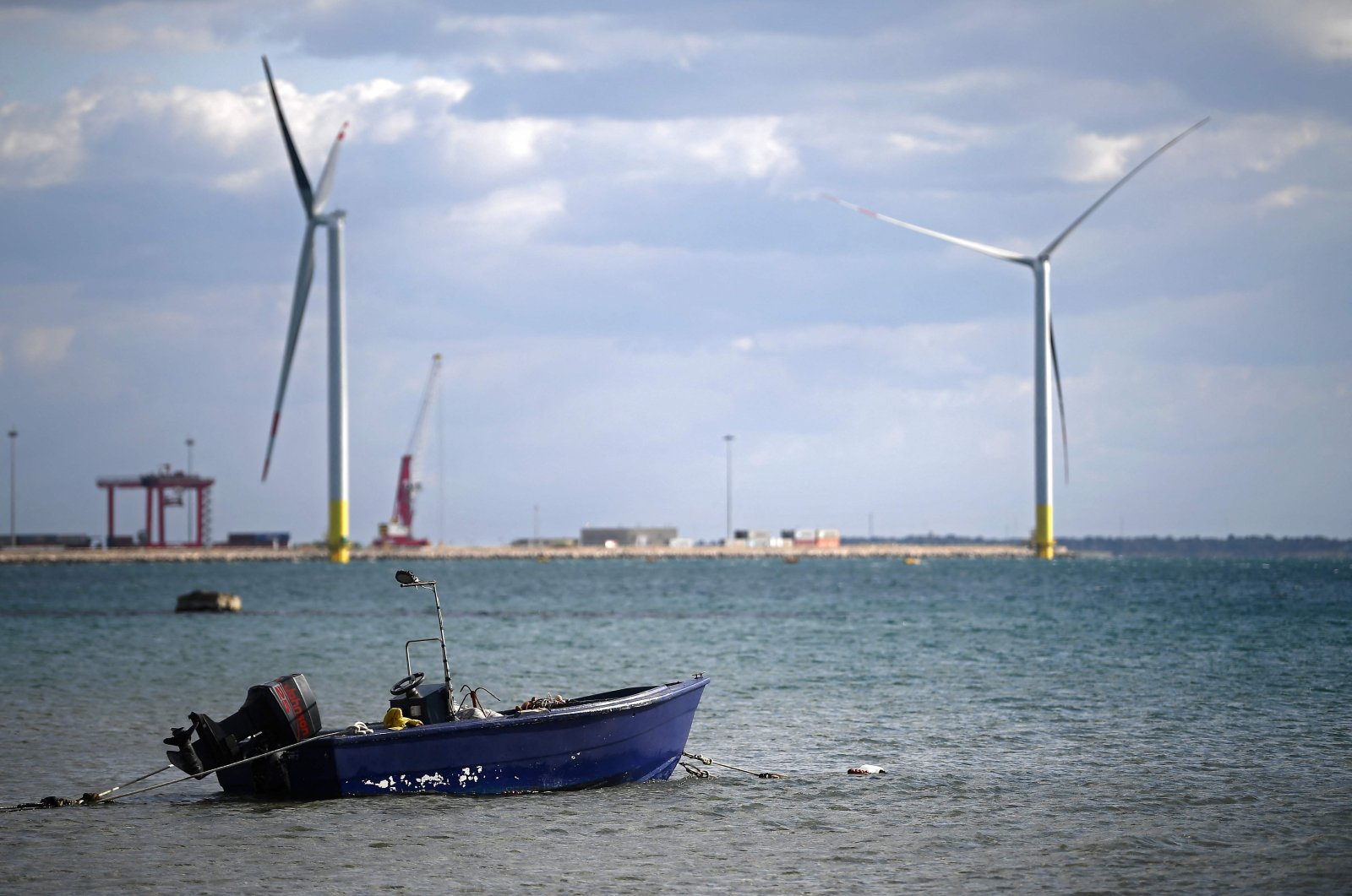 Wind turbines are pictured at the Taranto offshore wind turbines farm in Taranto, southern Italy, March 9, 2022. (Photo by Filippo MONTEFORTE / AFP)