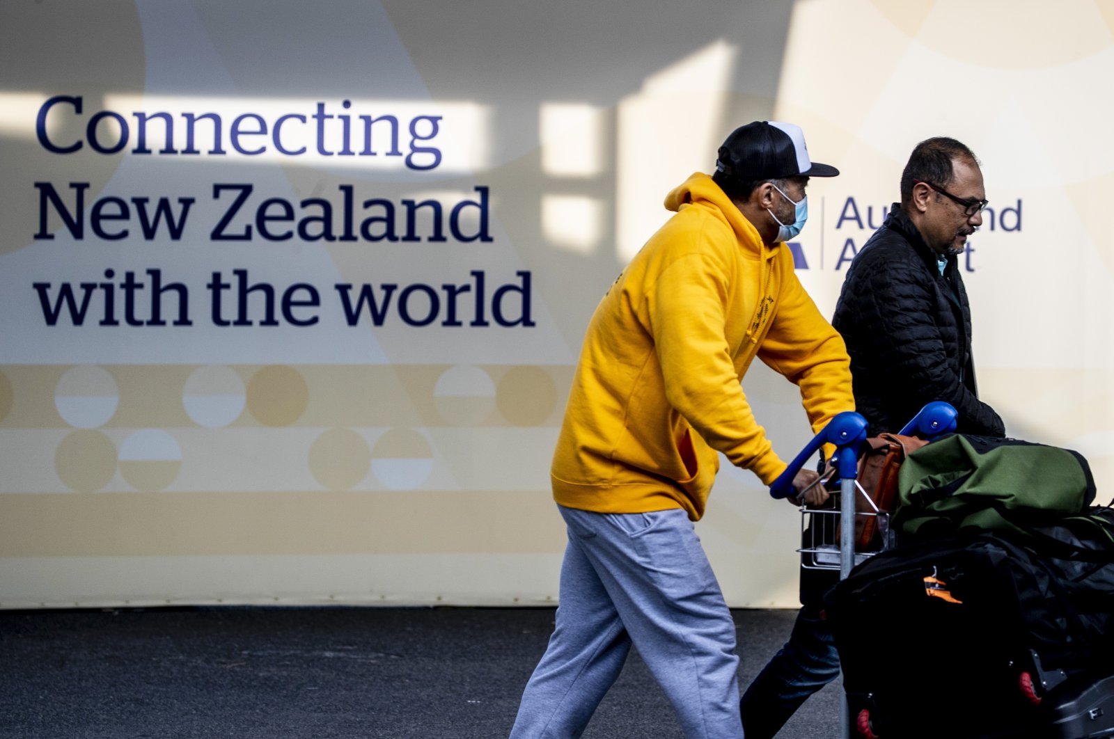 Passengers arrive at Auckland International Airport, in Auckland, New Zealand, March 16, 2022. (AP Photo)
