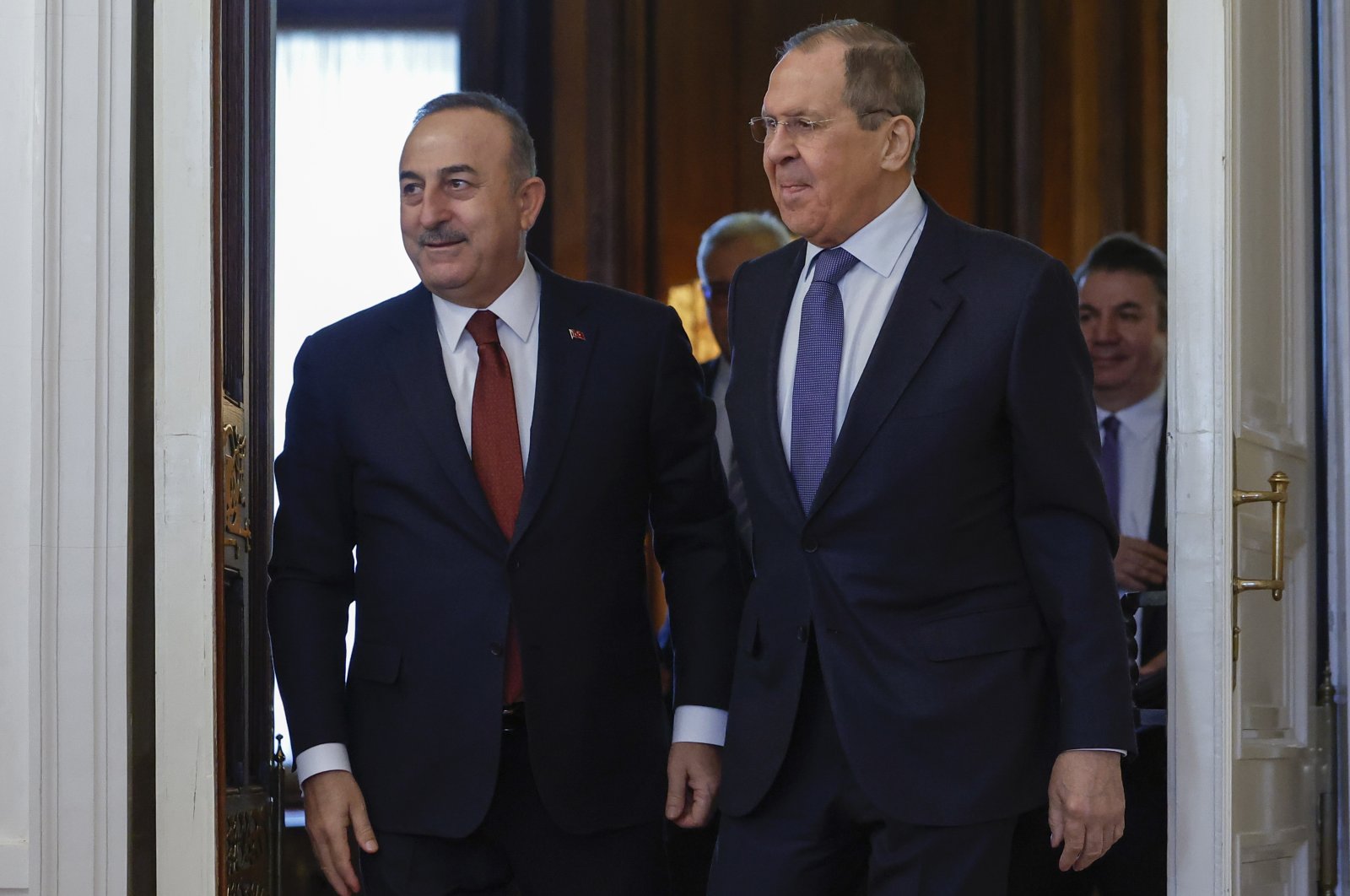 Foreign Minister Mevlüt Çavuşoğlu (L) and Russian Foreign Minister Sergey Lavrov enter a hall for their talks in Moscow, Russia, March 16, 2022. (AP Photo)