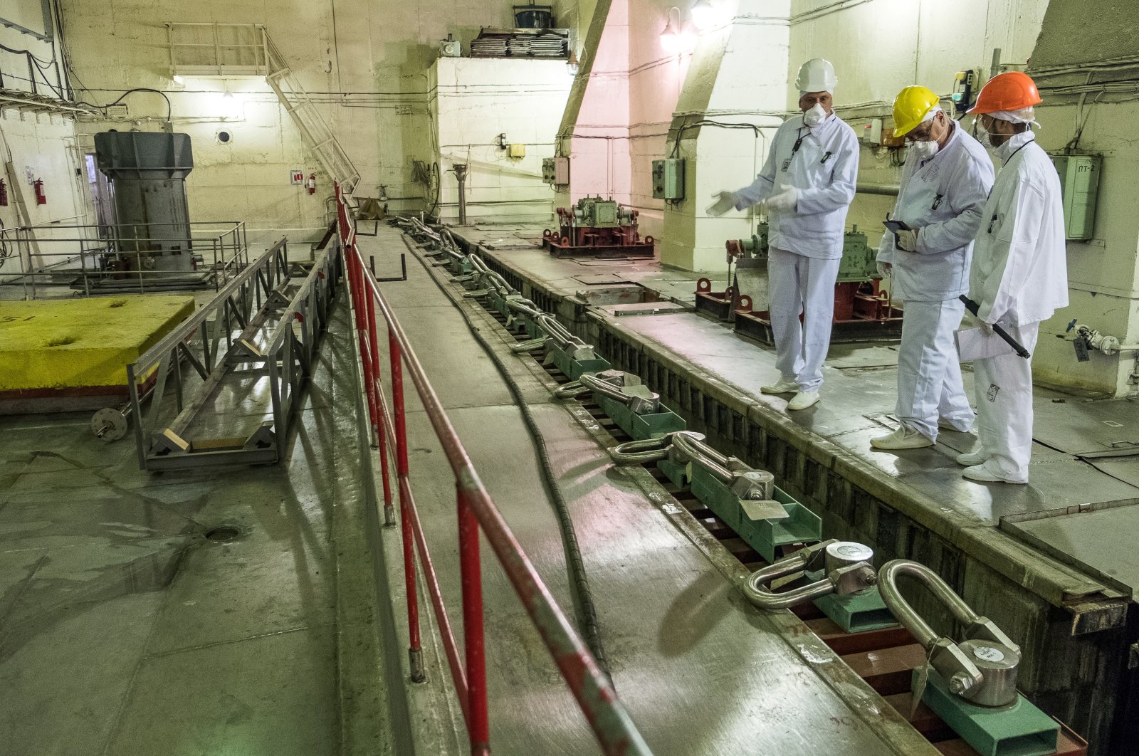 Engineers discuss the state of fuel assemblies at a wet spent fuel storage facility (ISF-1) in Chernobyl, Ukraine, May, 2017. (European Bank for Reconstruction and Development via Reuters)