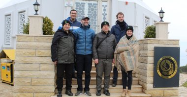 Turkish and French officials from the OGM, AFD, ONF and ONFI are seen in the entrance of a fire tower in Büyükada, Istanbul, March 16, 2022. (IHA Photo)