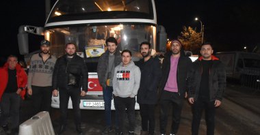 A bus carrying Turkish nationals evacuated from Ukraine bound for Istanbul stops at the Siret border gate on the Ukraine-Romania border, March 16, 2022. (AA Photo)