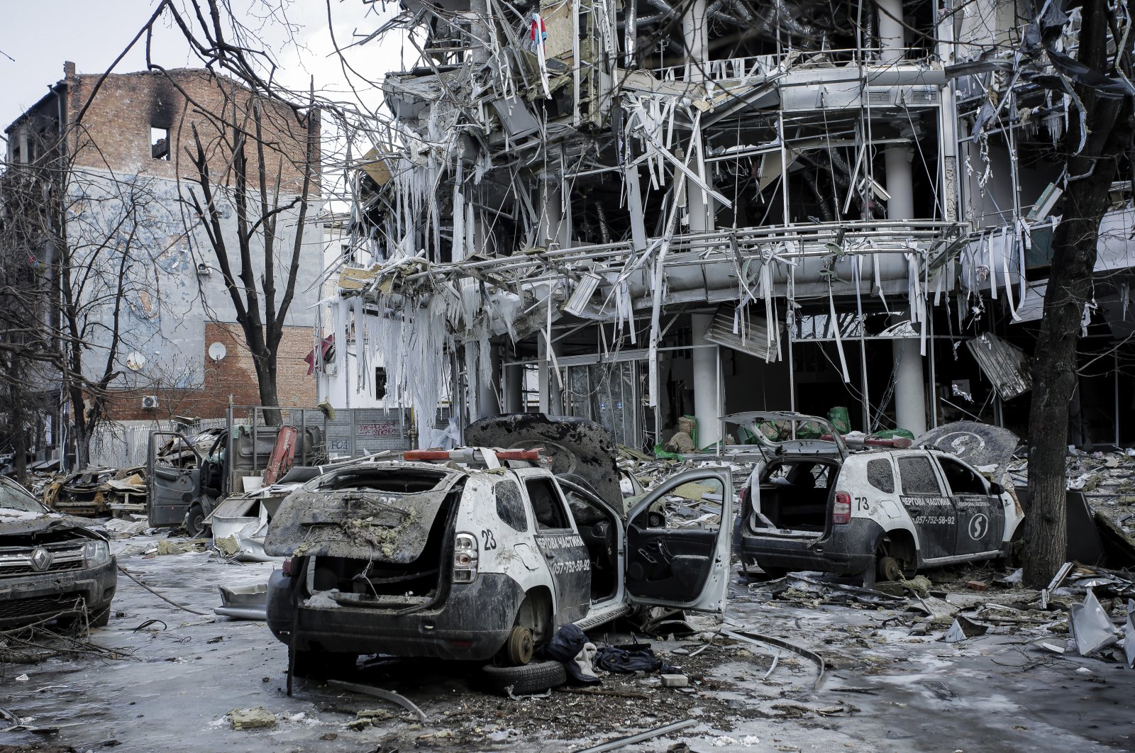 Damaged vehicles and buildings in Kharkiv&#039;s city center in Ukraine, March 16, 2022. (AP Photo)