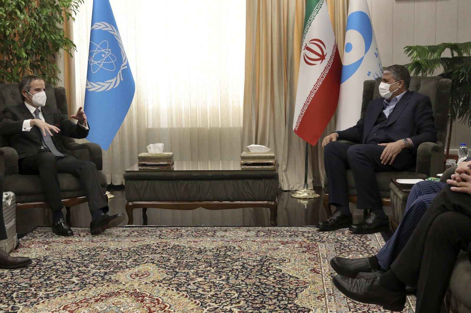 International Atomic Energy Organization (IAEA) Director-General Rafael Mariano Grossi (L) speaks with head of Atomic Energy Organization of Iran, Mohammad Eslami during their meeting in Tehran, on March 5, 2022. (AP Photo)