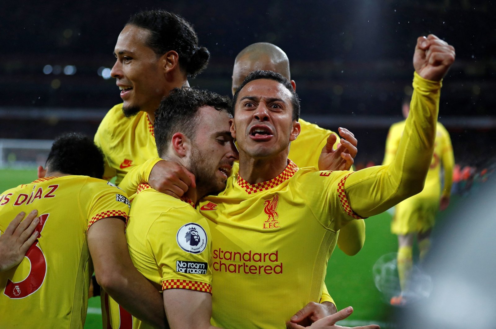 Liverpool&#039;s Diogo Jota (2nd L) celebrates with teammates after scoring in a Premier League game against Arsenal, London, England, March 16, 2022. (AFP Photo)