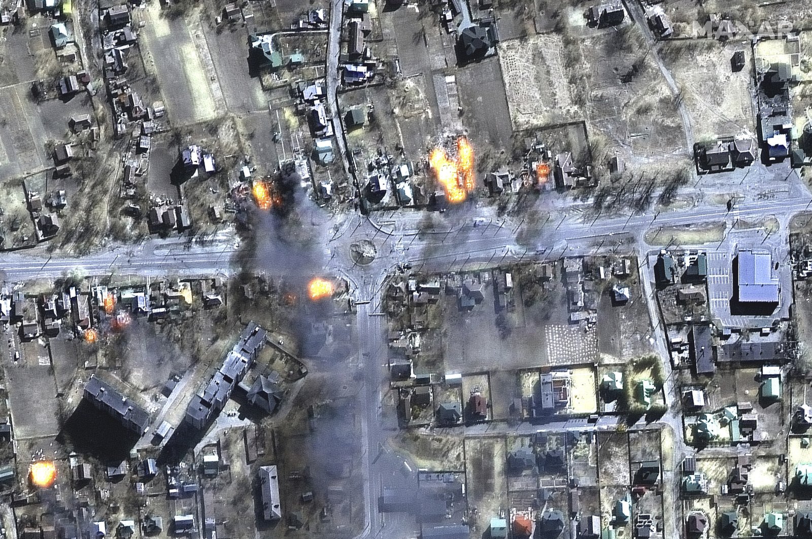 This satellite image provided by Maxar Technologies shows burning buildings in a residential area in northeast Chernihiv, Ukraine, March 16, 2022. (Maxar Technologies via AP)