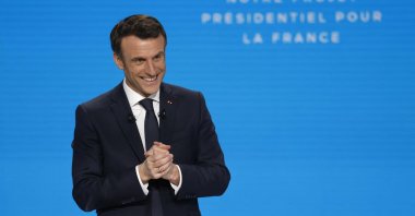 France's President Emmanuel Macron reacts during a press conference to present his political program ahead of the April 10/24 presidential election in France, in Paris' suburban city of Aubervilliers, March 17, 2022. (AFP Photo)