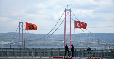 People take photos of the 1915 Çanakkale Bridge, Çanakkale, Turkey, March 18, 2022. (AA Photo)
