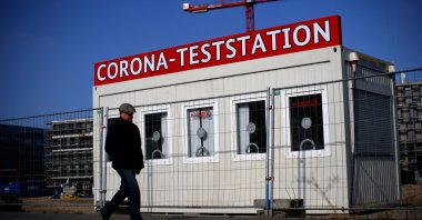 A person walks past a closed COVID-19 testing station in Berlin, Germany, March 18, 2022. (Reuters Photo)