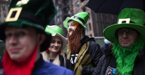 People watch the St. Patrick's Day Parade on Fifth Avenue, in New York, U.S., March 17, 2022. (AP Photo)
