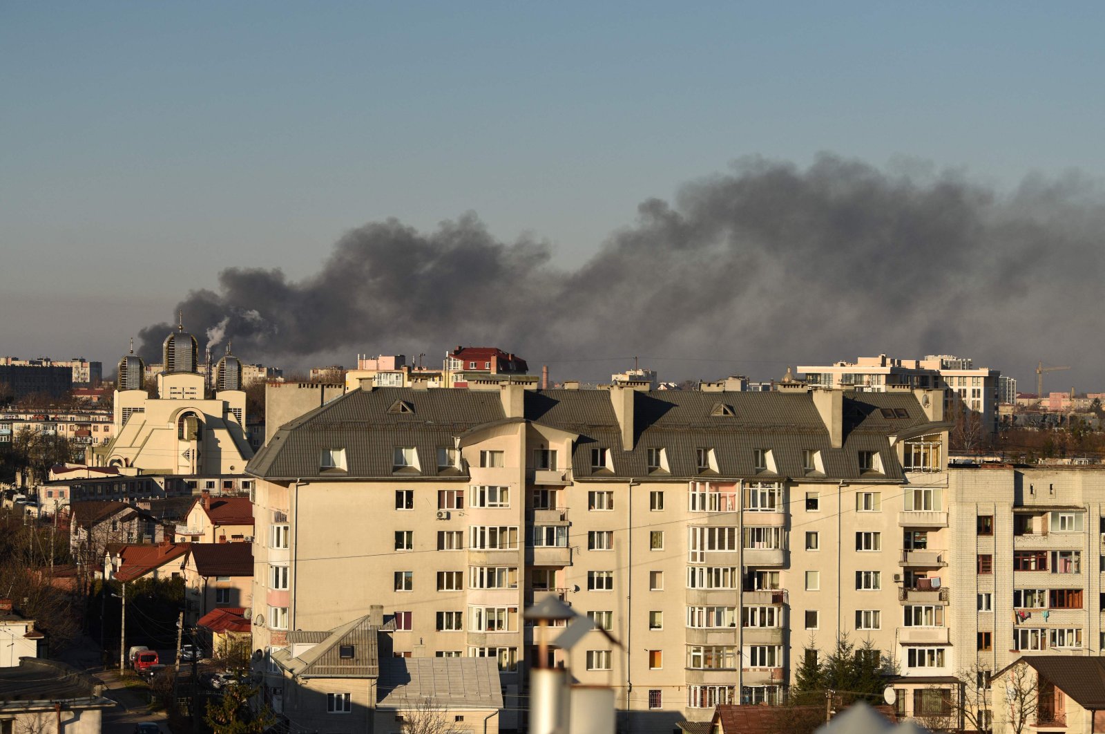 Smoke rises after an explosion in the western Ukrainian city of Lviv, March 18, 2022. (AFP Photo)