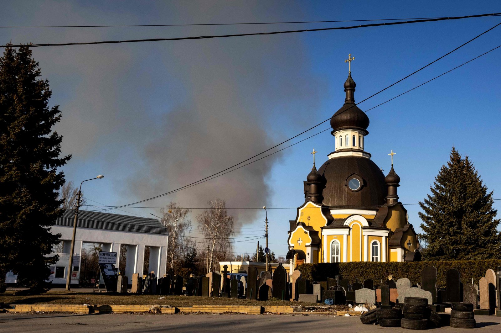 Smoke rises after an explosion in Kyiv on March 17, 2022, as Russian troops try to encircle the Ukrainian capital as part of their slow-moving offensive. (AFP Photo)