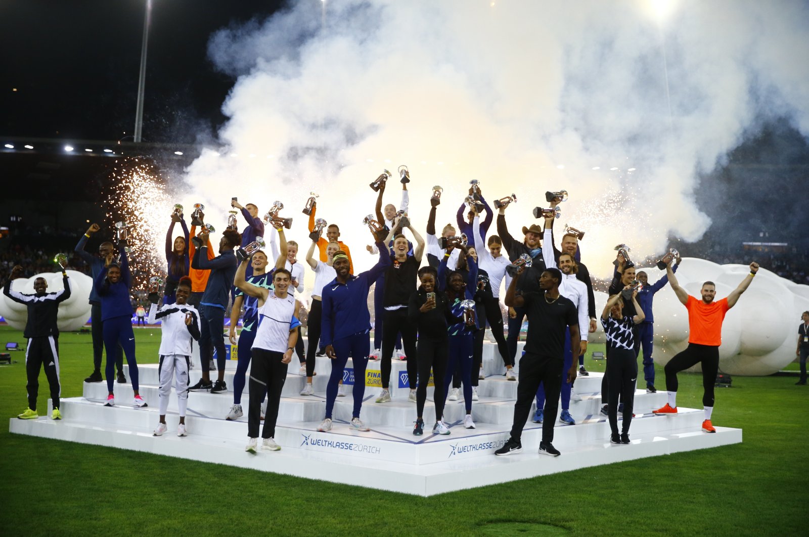 Athletes celebrate with their trophies after the athletics Zurich Diamond League, Letzigrund, Switzerland, Sept. 9, 2021. (Reuters Photo)