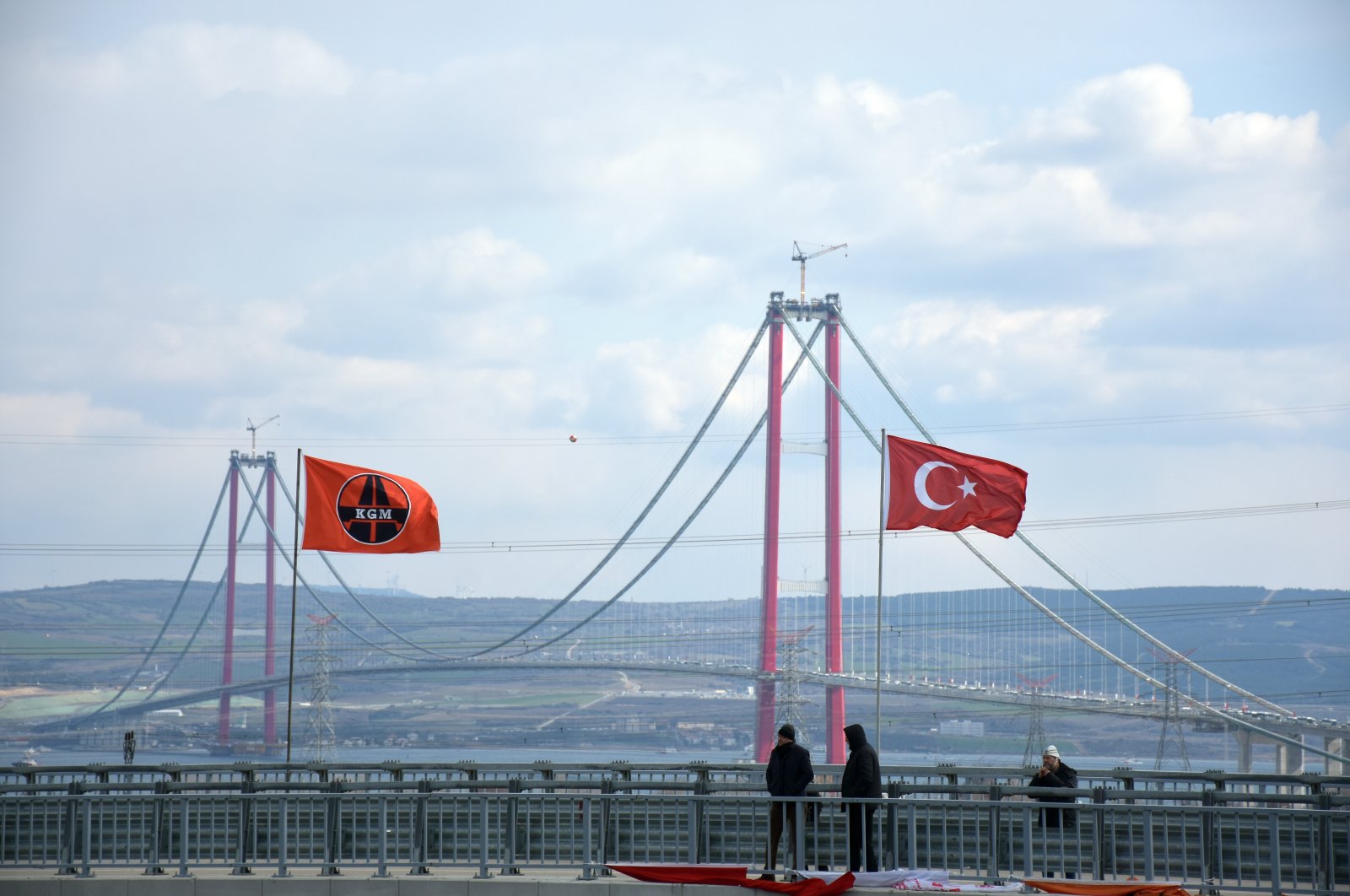 People take photos of the 1915 Çanakkale Bridge, Çanakkale, Turkey, March 18, 2022. (AA Photo)