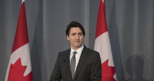 Prime Minster Justin Trudeau delivers remarks during a Liberal Party fundraising event at the Versailles Convention Centre in Mississauga, Ontario, Thursday, March 17, 2022. (Tijana Martin/The Canadian Press via AP)