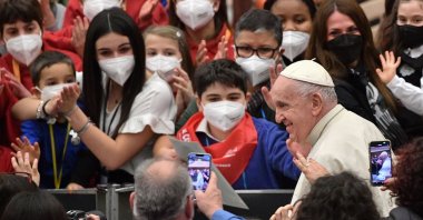 Pope Francis meets with attendees during an audience for the Choirs of Antoniano, at Paul-VI hall in The Vatican, March 19, 2022. (AFP Photo)