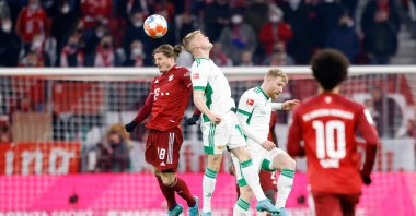 Bayern Munich's Austrian midfielder Marcel Sabitzer (L) and Union Berlin's Hungarian midfielder Andras Schaefer vie for the ball during the German first division Bundesliga football match FC Bayern Munich v FC Union Berlin in Munich, southern Germany, March 19, 2022. (AFP Photo)