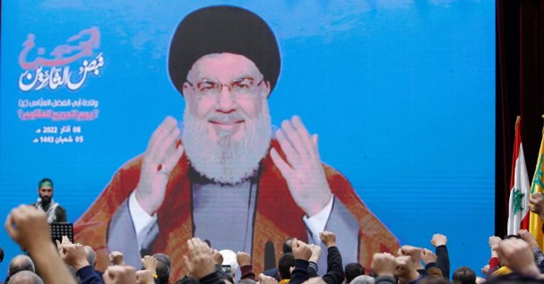 Lebanon's Hezbollah leader Sayyed Hassan Nasrallah addresses his supporters from a screen during a rally to commemorate Hezbollah Wounded Veterans Day, Beirut, Lebanon, March 8, 2022. (Reuters Photo)