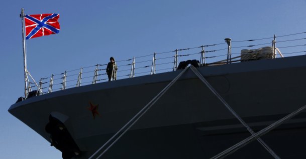 A Russian sailor stands guard on the Russian war ship "Peter the Great" in the southern port city of Limassol, Feb. 12, 2014. (AP Photo)