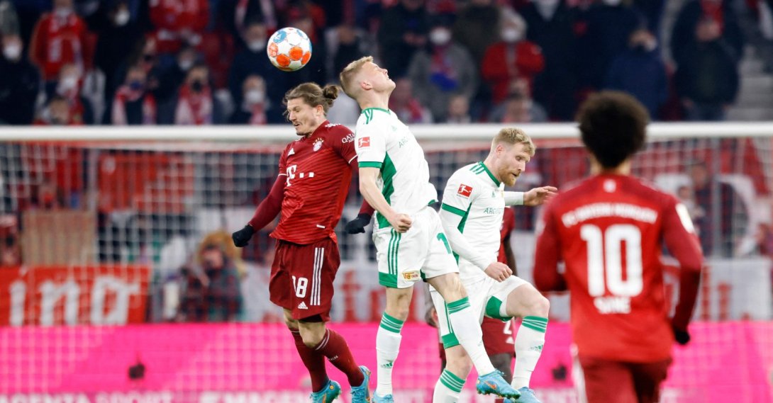 Bayern Munich's Austrian midfielder Marcel Sabitzer (L) and Union Berlin's Hungarian midfielder Andras Schaefer vie for the ball during the German first division Bundesliga football match FC Bayern Munich v FC Union Berlin in Munich, southern Germany, March 19, 2022. (AFP Photo)