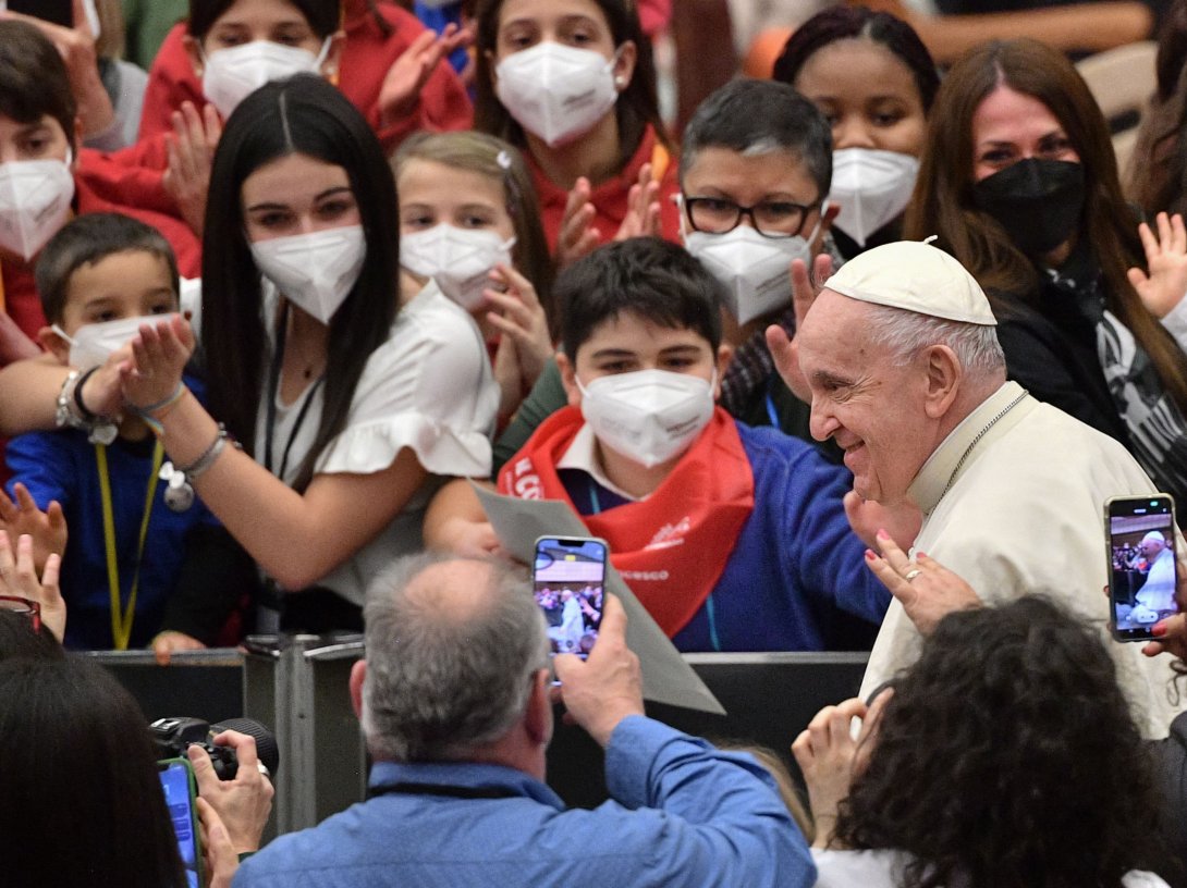 Pope Francis meets with attendees during an audience for the Choirs of Antoniano, at Paul-VI hall in The Vatican, March 19, 2022. (AFP Photo)