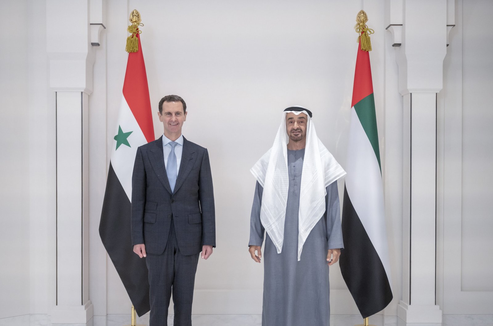 A handout photo made available by Ministry of Presidential Affairs - Abu Dhabi shows Crown Prince of Abu Dhabi and Deputy Supreme Commander of the UAE Armed Forces, Sheikh Mohamed bin Zayed Al Nahyan (R) and Syrian regime&#039;s Bashar Al Assad (L) after their meeting at Al Shati Palace in Abu Dhabi, United Arab Emirates, March 18, 2022. (EPA Photo)