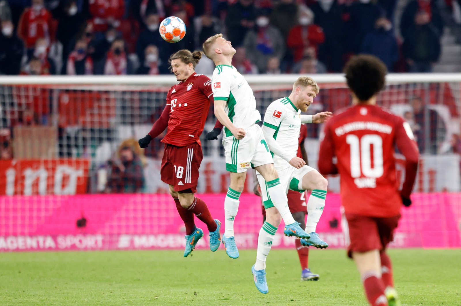 Bayern Munich&#039;s Austrian midfielder Marcel Sabitzer (L) and Union Berlin&#039;s Hungarian midfielder Andras Schaefer vie for the ball during the German first division Bundesliga football match FC Bayern Munich v FC Union Berlin in Munich, southern Germany, March 19, 2022. (AFP Photo)