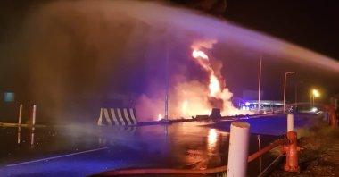 Firefighters try to extinguish a blaze at an Aramco terminal in the southern border town of Jizan, Saudi Arabia, March 20, 2022. (AP Photo)