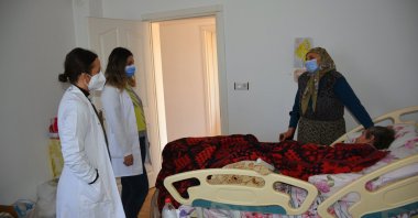 Muğla Metropolitan Municipality domiciliary care personnel are seen with a patient during a home visit, Muğla, Turkey,  March 19, 2022. (IHA File Photo)