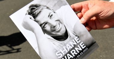 A memorial card from Australian cricket great Shane Warne's funeral, Melbourne, Australia, March 20, 2022. (AFP Photo)